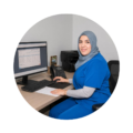 Fouzia, Clinical Director and internationally trained dentist, working at a clinic workstation during advanced clinical training