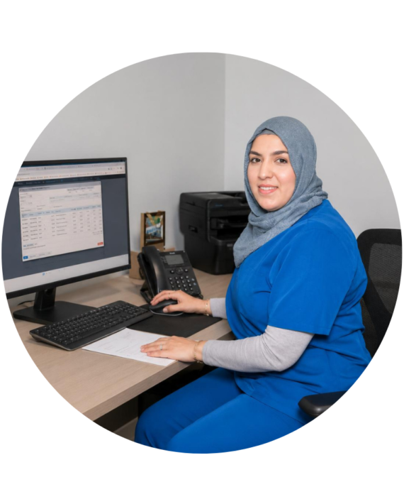 Fouzia, Clinical Director and internationally trained dentist, working at a clinic workstation during advanced clinical training