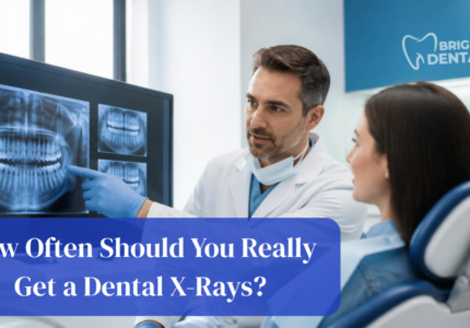Dentist reviewing digital dental x-rays to determine patient x-ray frequency at Bright Dental